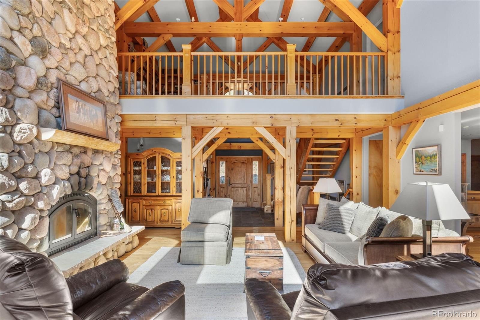 13445 Baird Road Conifer, CO 80433 - Photo 12 of 50 a view of a patio with couches table and chairs and potted plants