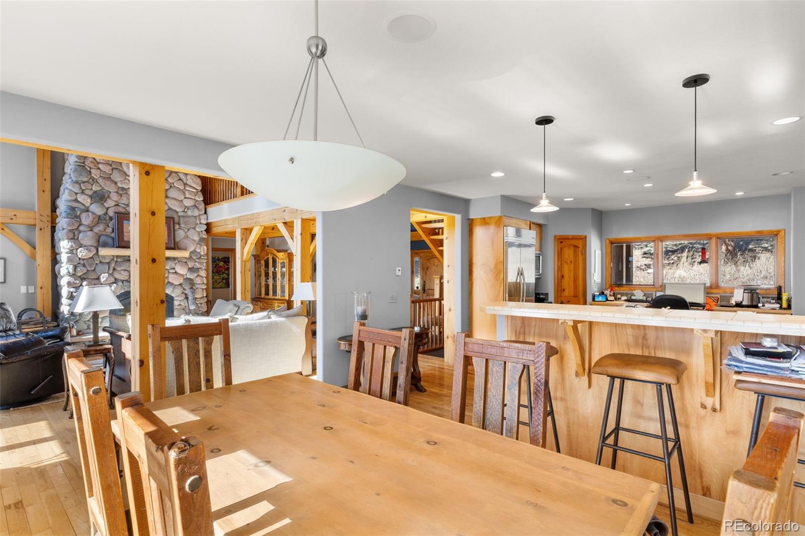 13445 Baird Road Conifer, CO 80433 - Photo 15 of 50 a large kitchen with a table and chairs
