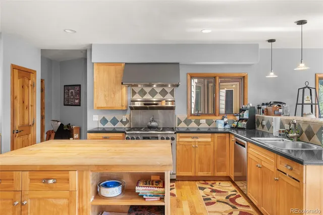a spacious bathroom with a sink a mirror and a bathtub