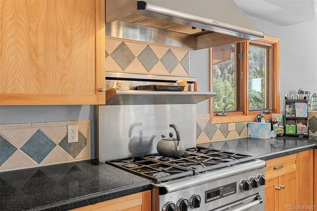 a kitchen with a stove and a microwave