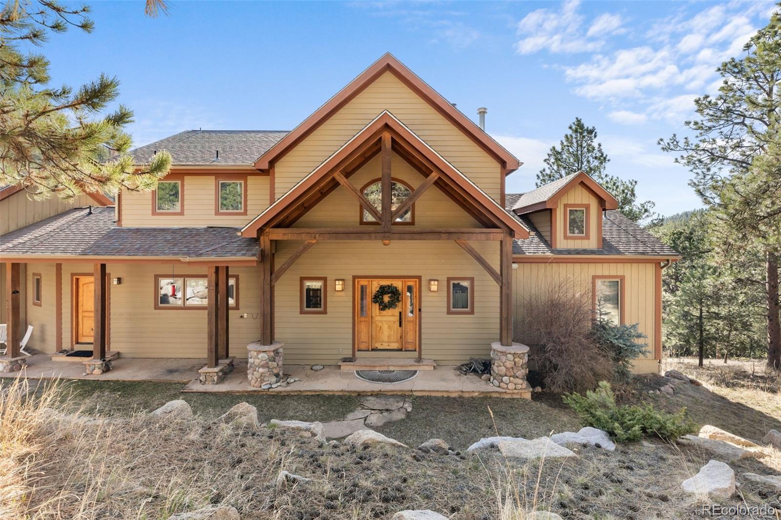 13445 Baird Road Conifer, CO 80433 - Photo 2 of 50 a front view of a house