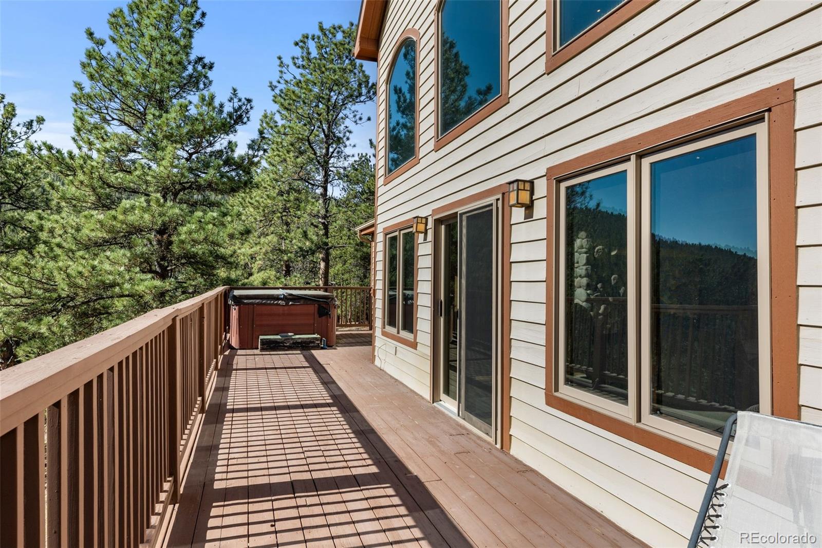 13445 Baird Road Conifer, CO 80433 - Photo 33 of 50 a view of balcony with wooden floor and fence