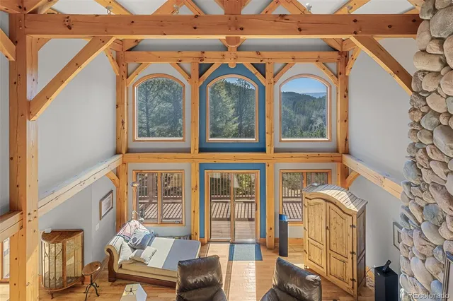 a blue bed sitting next to a window