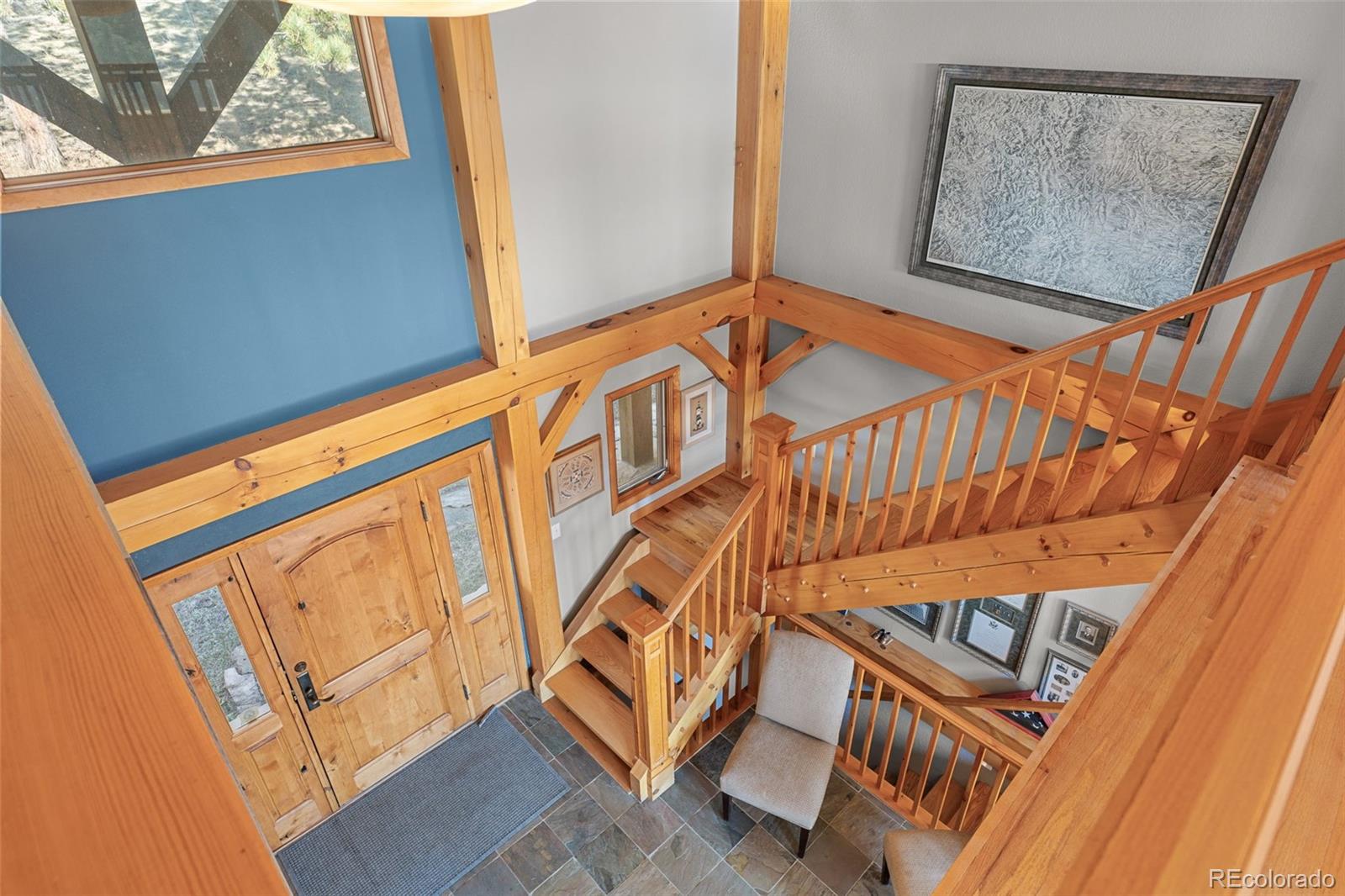 13445 Baird Road Conifer, CO 80433 - Photo 40 of 50 a blue bed sitting next to a window