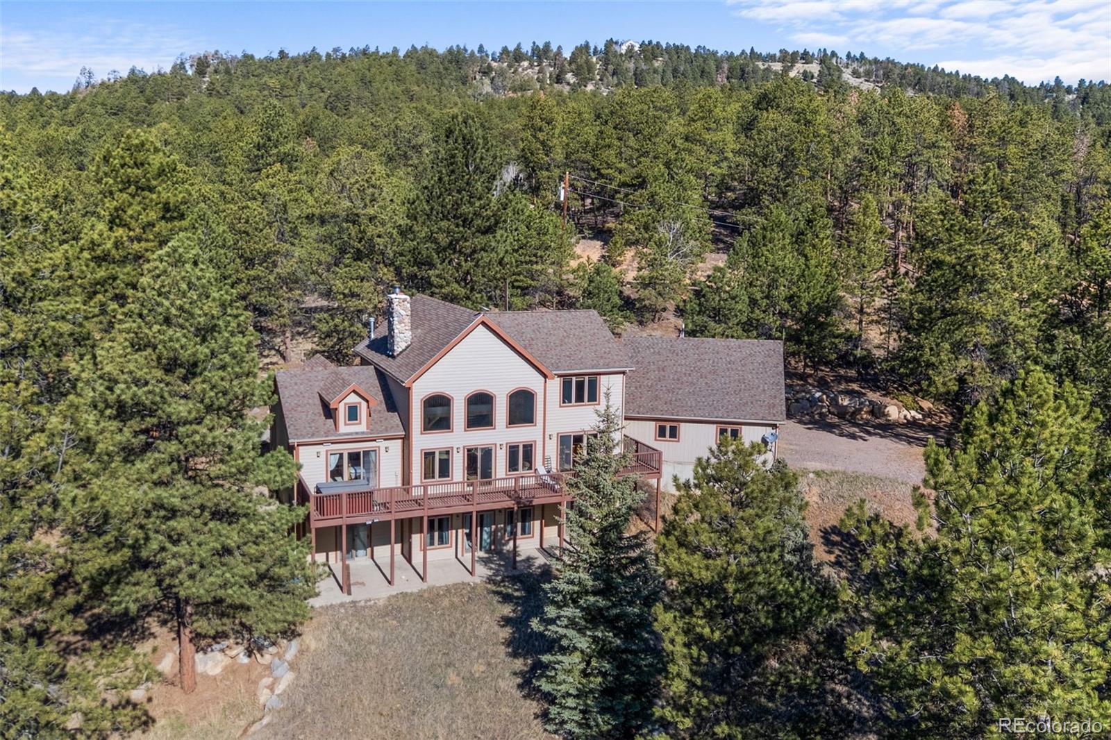 13445 Baird Road Conifer, CO 80433 - Photo 48 of 50 an aerial view of a house with a yard