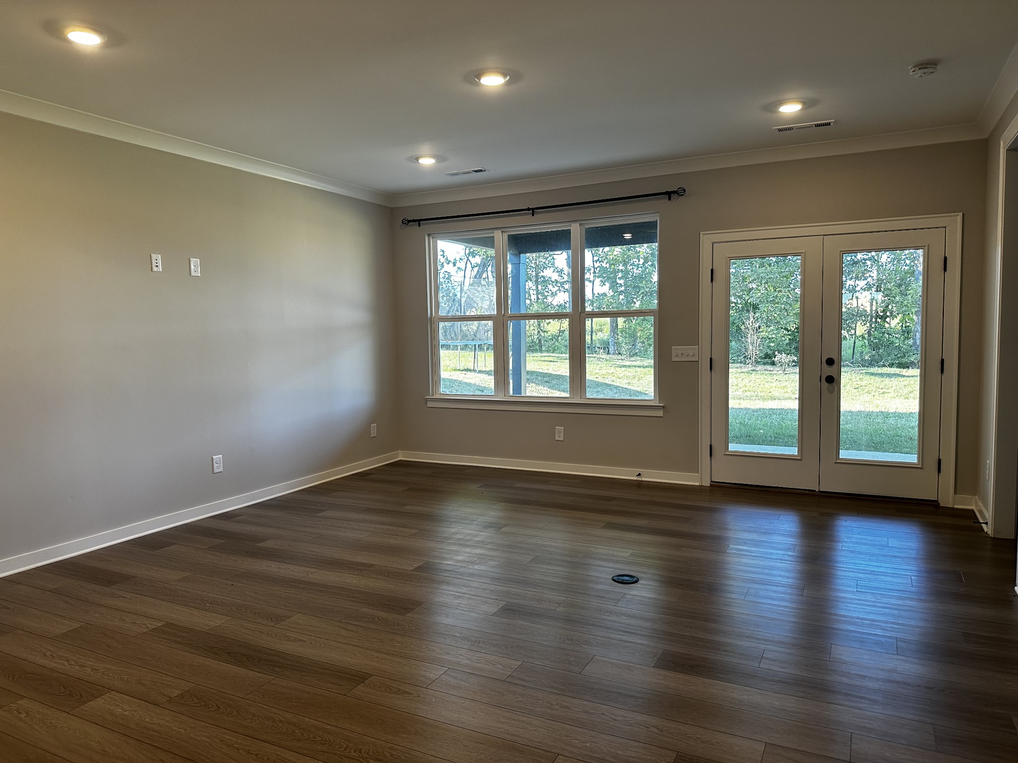 1065 Fallow Road Mount Juliet, TN 37122 - Photo 16 of 55 a view of an empty room with wooden floor and a window
