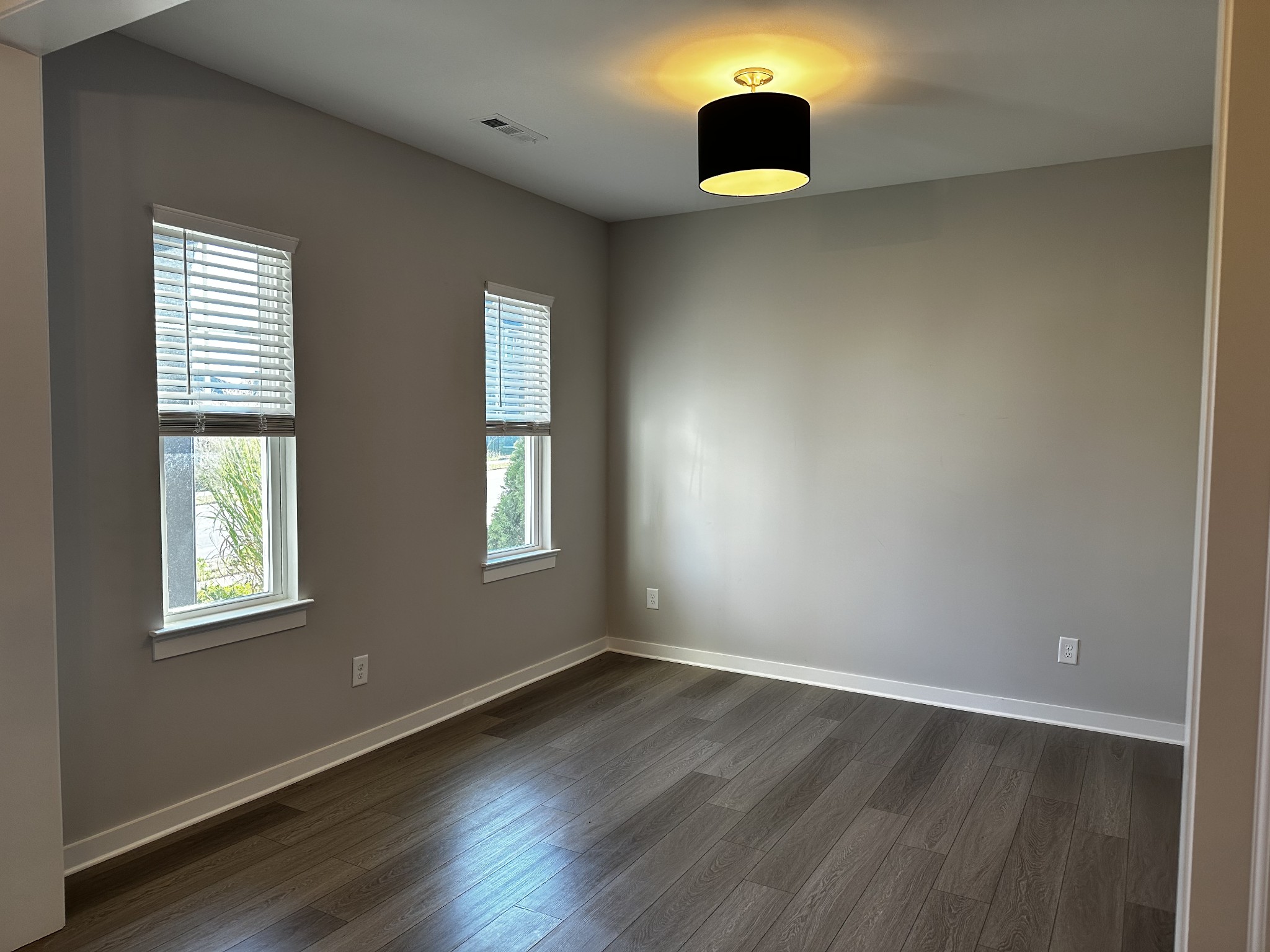 1065 Fallow Road Mount Juliet, TN 37122 - Photo 4 of 55 an empty room with wooden floor and windows
