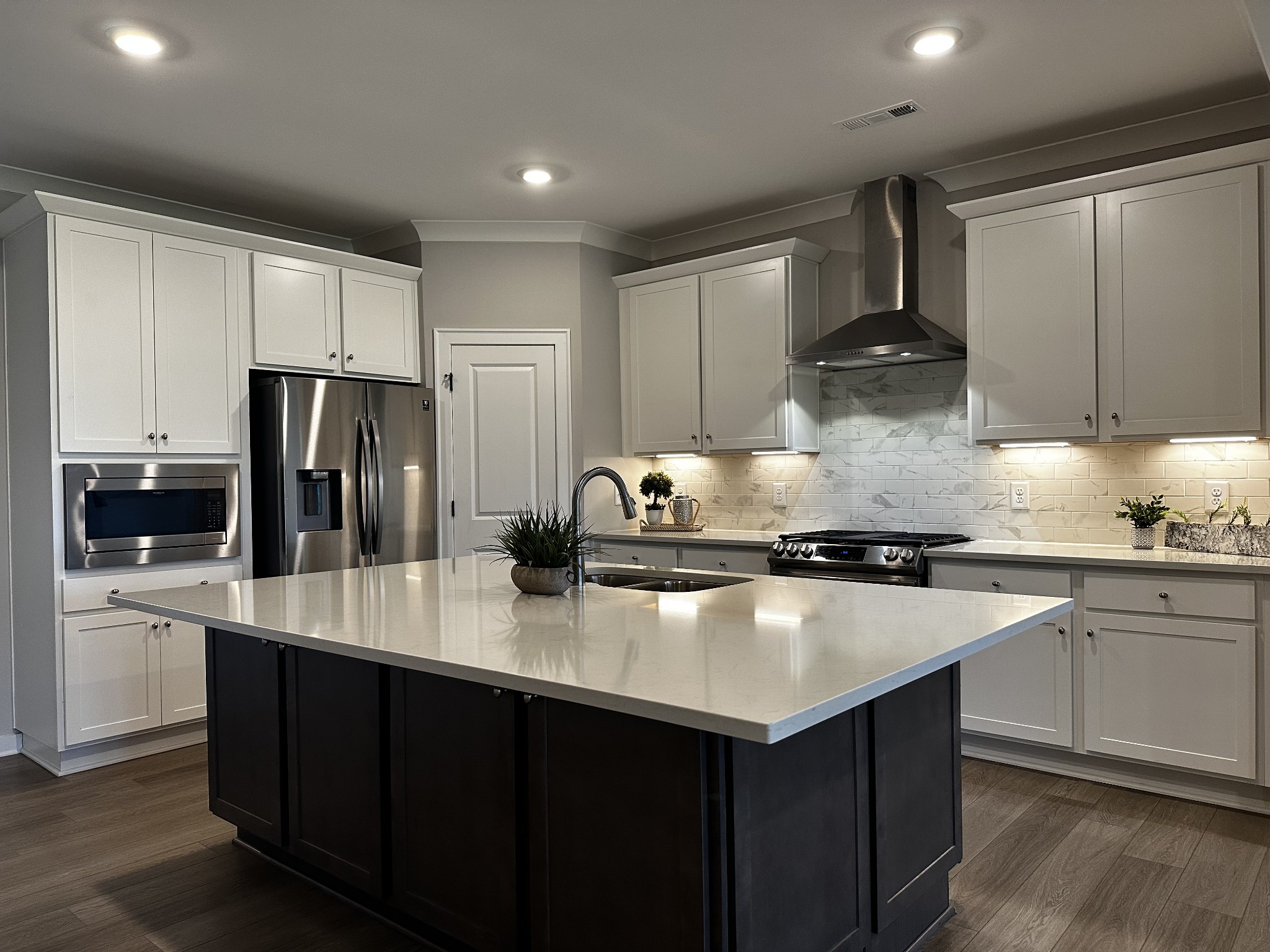 1065 Fallow Road Mount Juliet, TN 37122 - Photo 8 of 55 a kitchen with kitchen island granite countertop a sink stove and refrigerator