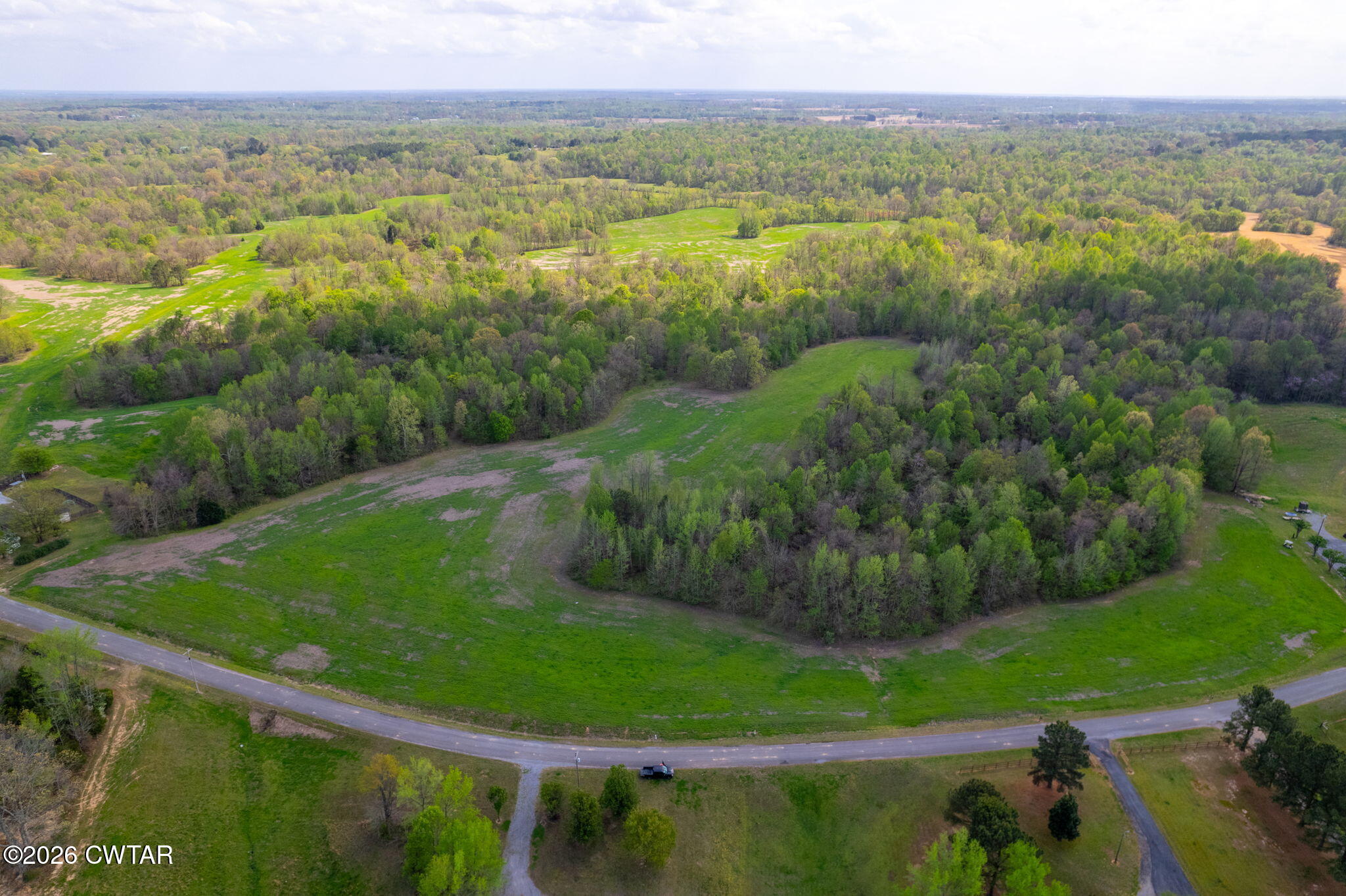 0 Bald Knob Road Ripley, TN 38063 - Photo 21 of 22 a view of a city with lush green forest