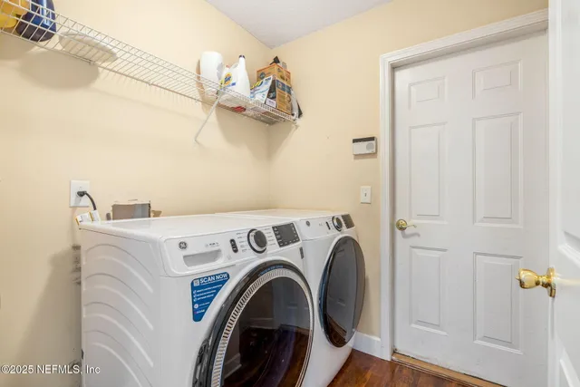 a utility room with dryer and washer