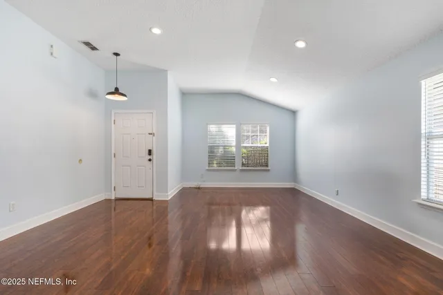 a view of livingroom with hardwood floor and a ceiling fan
