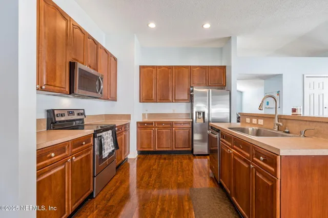 a living room with furniture gym equipment and a large window