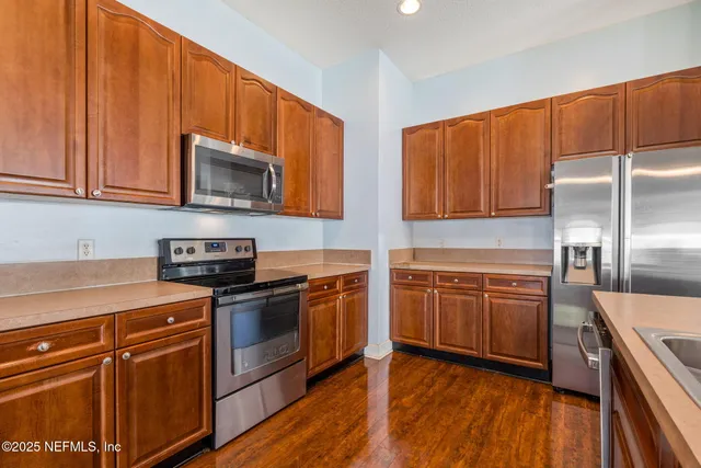 a living room with furniture window and wooden floor