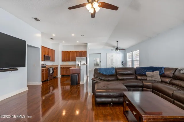a bathroom with a sink vanity tub and a mirror