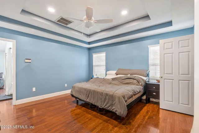 a front view of a house with a yard and pathway