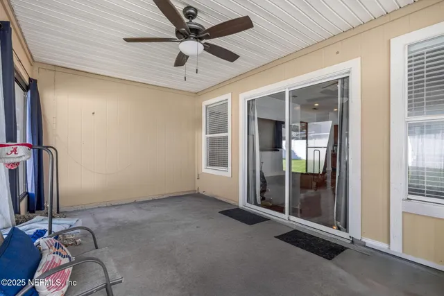 a living room with furniture window and wooden floor