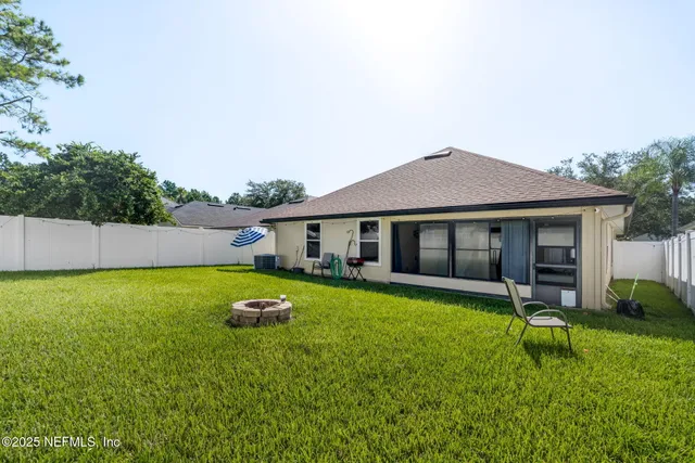 a spacious bedroom with a bed and a table