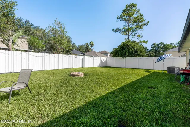 a living room with furniture gym equipment and a large window