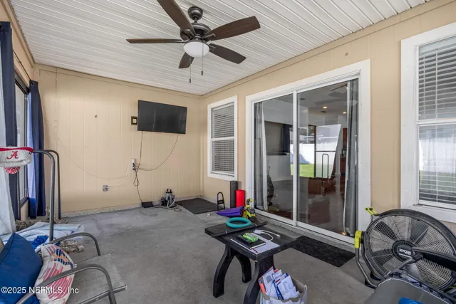 a kitchen with a stove window and wooden cabinets