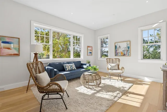 a spacious bedroom with a bed and a couch