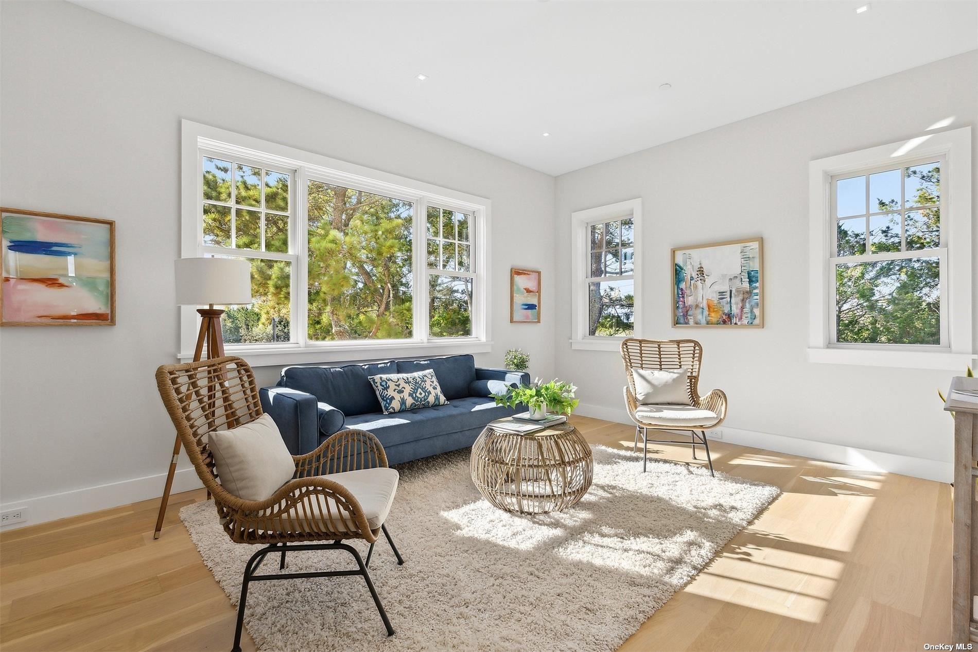 218 Dune Road Westhampton Beach, NY 11978 - Photo 12 of 25 a living room with furniture and a window