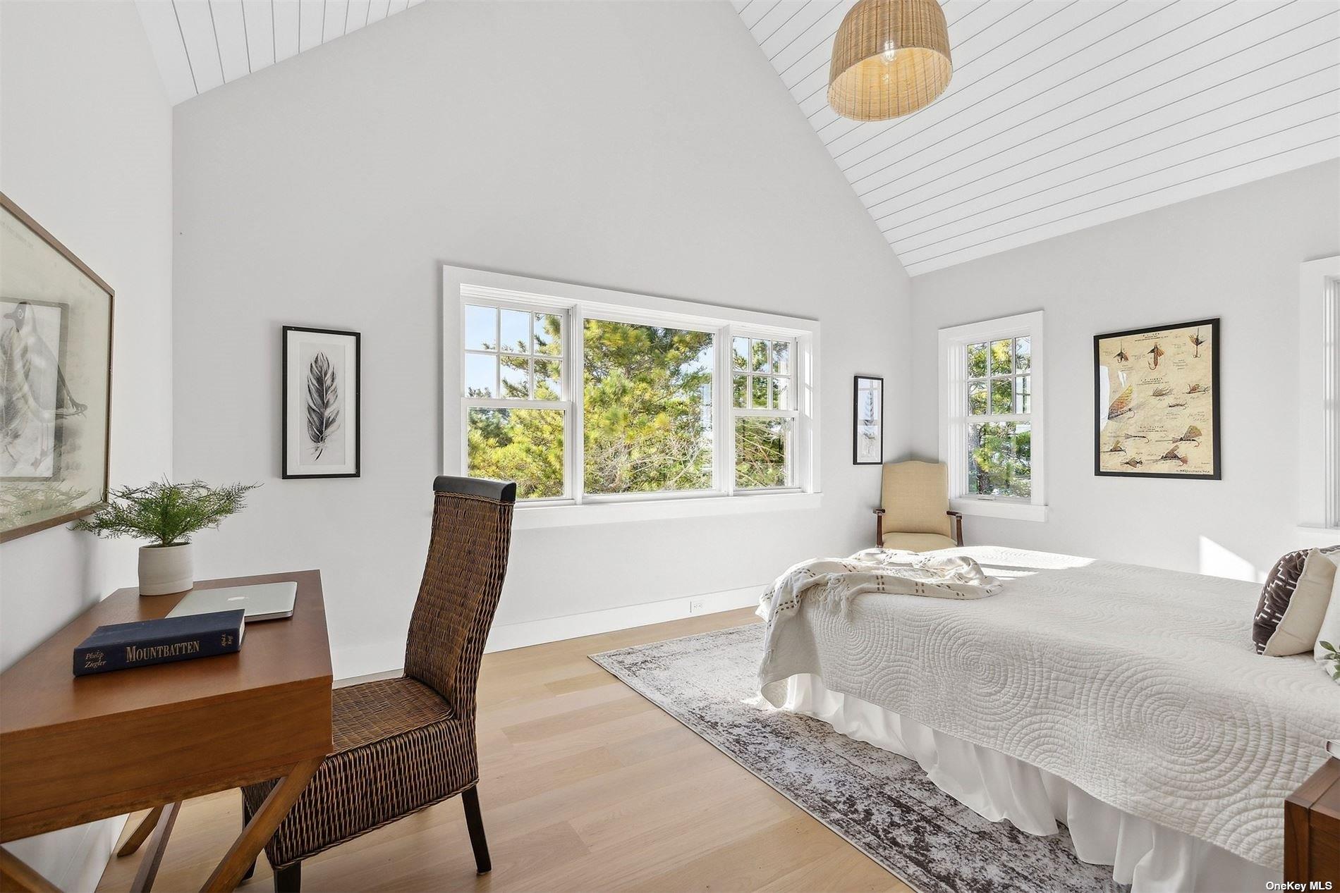 218 Dune Road Westhampton Beach, NY 11978 - Photo 18 of 25 a bedroom with a bed and a window