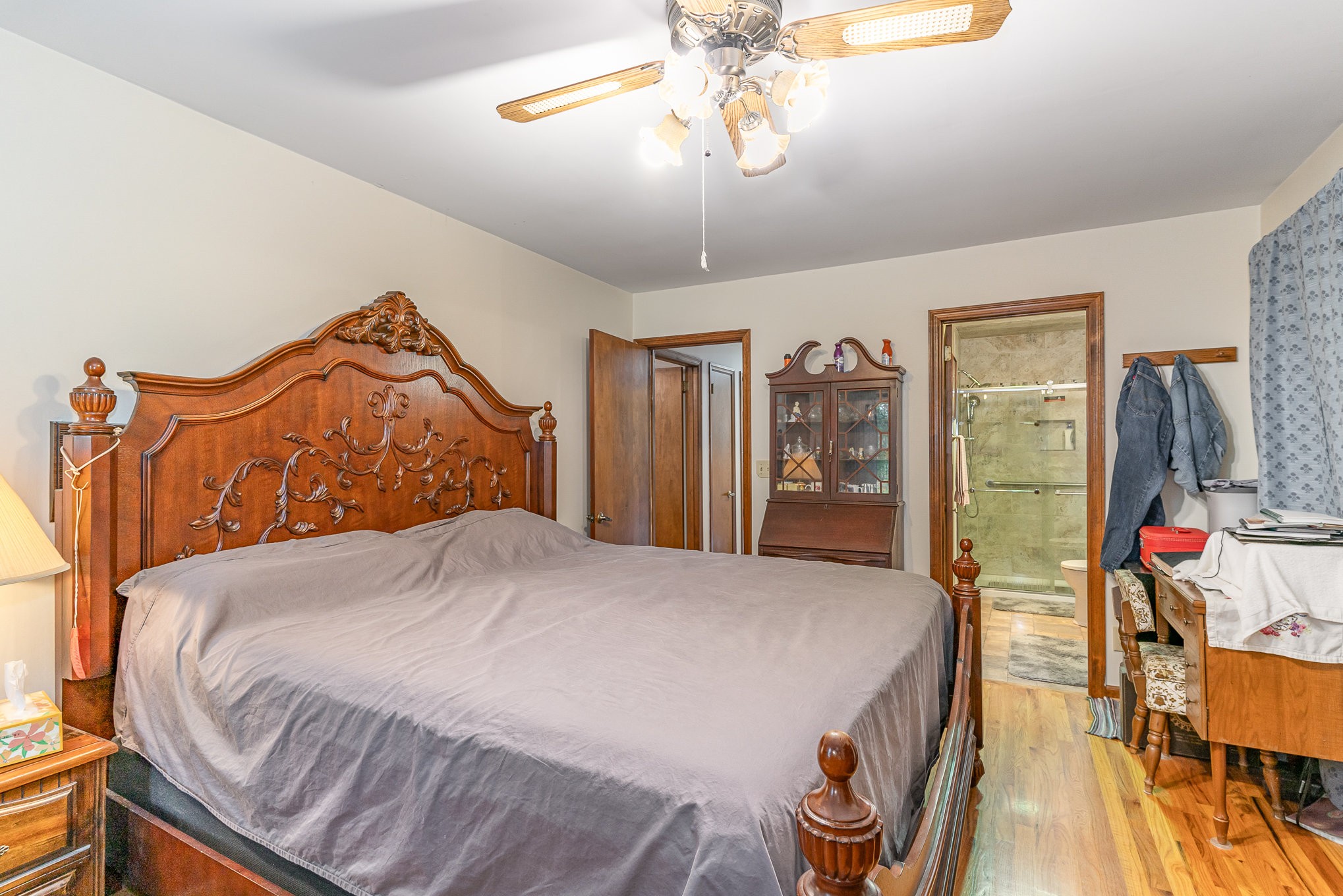 2847 Ashwood Road Columbia, TN 38401 - Photo 12 of 38 a bedroom with a bed and a chandelier