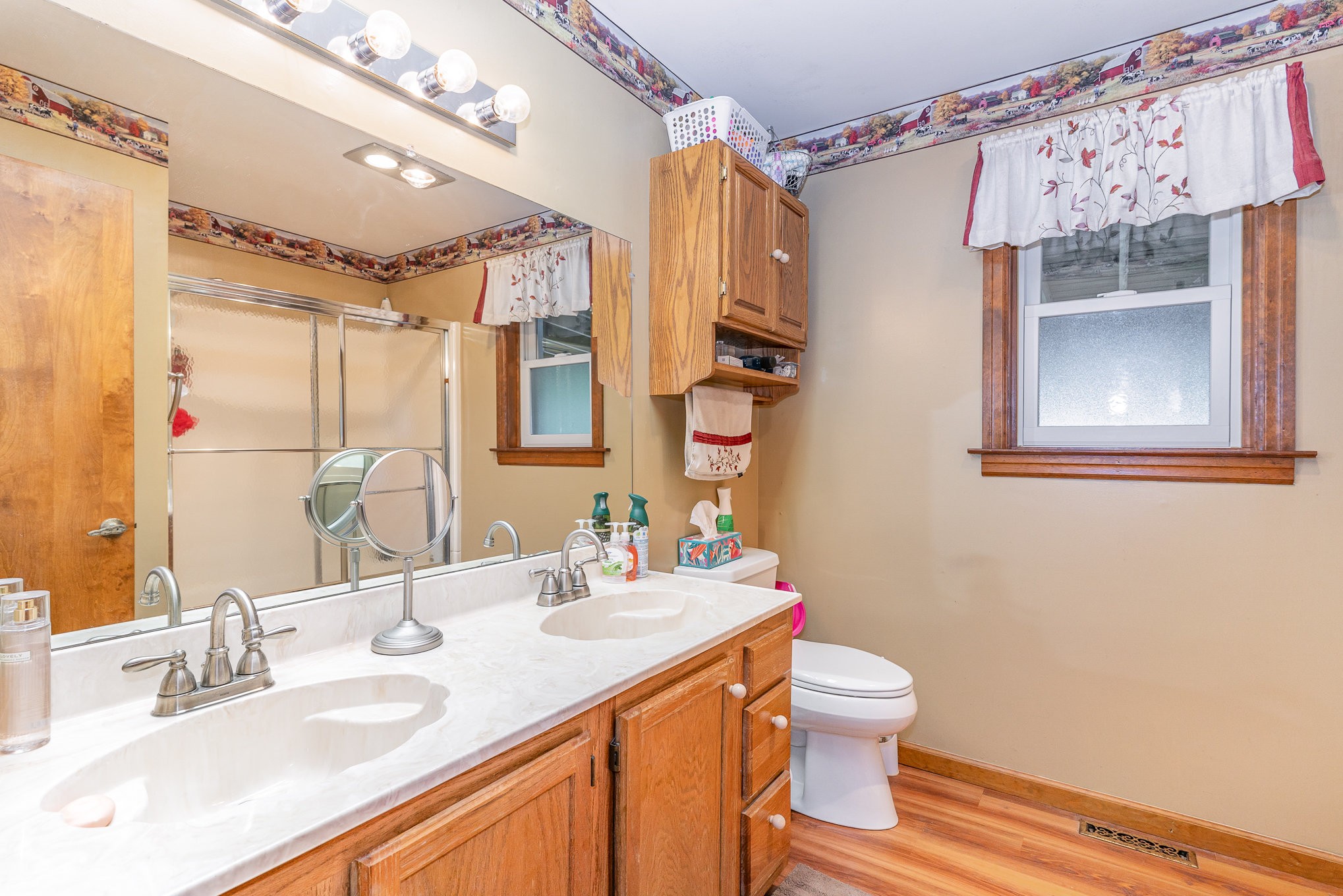 2847 Ashwood Road Columbia, TN 38401 - Photo 16 of 38 a bathroom with a granite countertop sink a toilet and a mirror