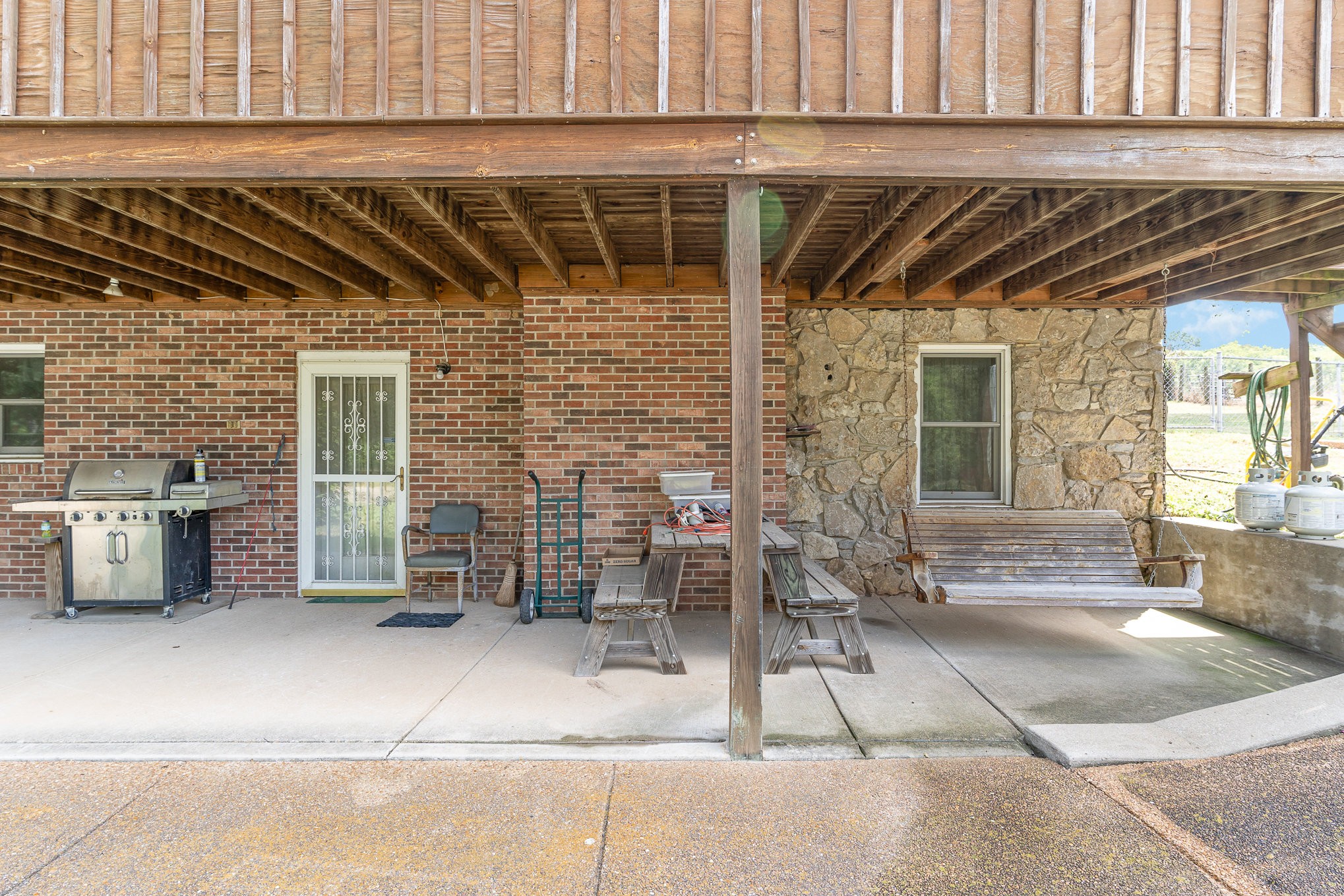 2847 Ashwood Road Columbia, TN 38401 - Photo 22 of 38 a view of a porch with a table and chairs and potted plants