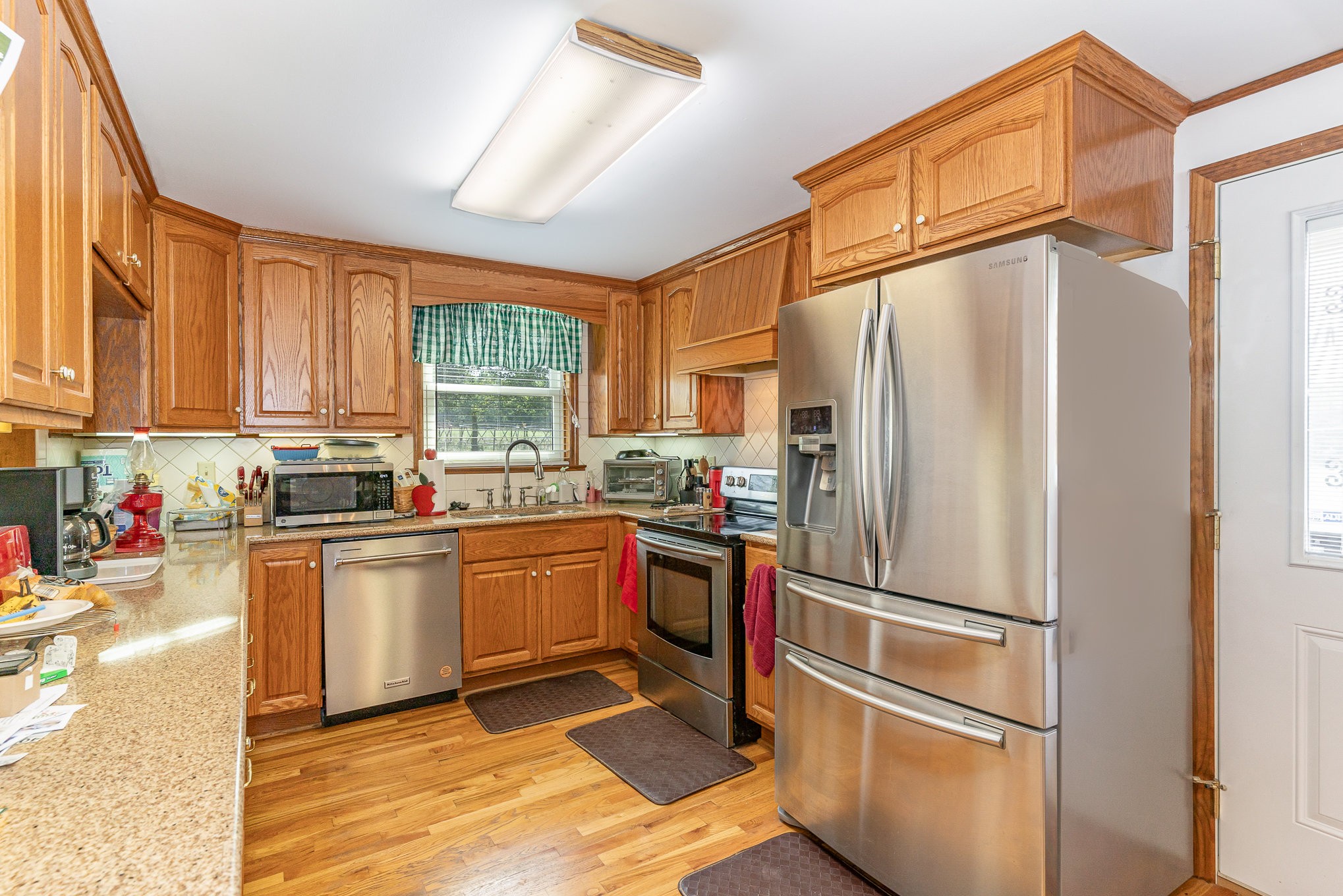 2847 Ashwood Road Columbia, TN 38401 - Photo 10 of 38 a kitchen with stainless steel appliances granite countertop a refrigerator and a stove top oven