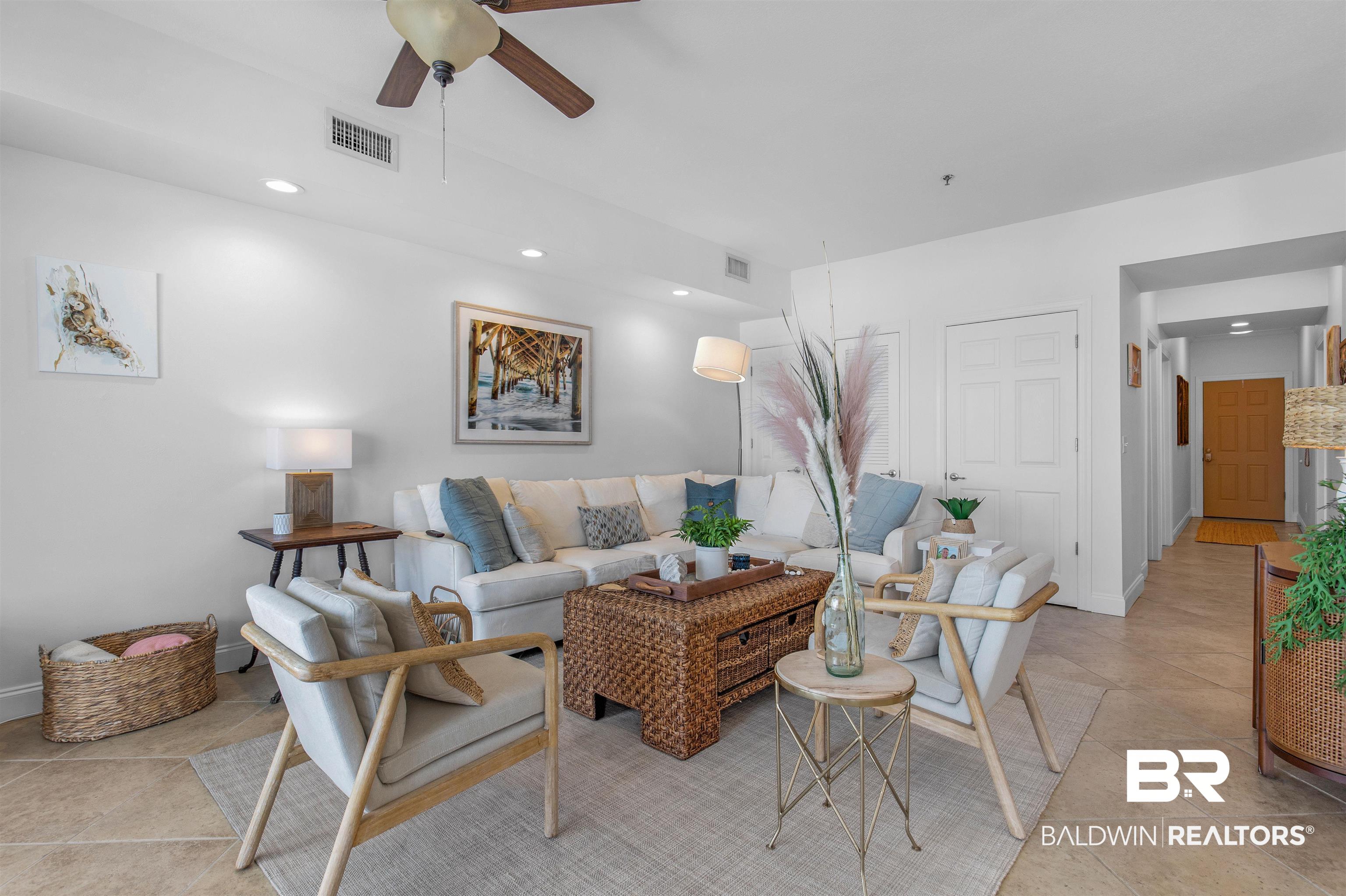 25909 Canal Road, Unit 301 Orange Beach, AL 36561 - Photo 4 of 43 Living room featuring ceiling fan and light tile patterned floors