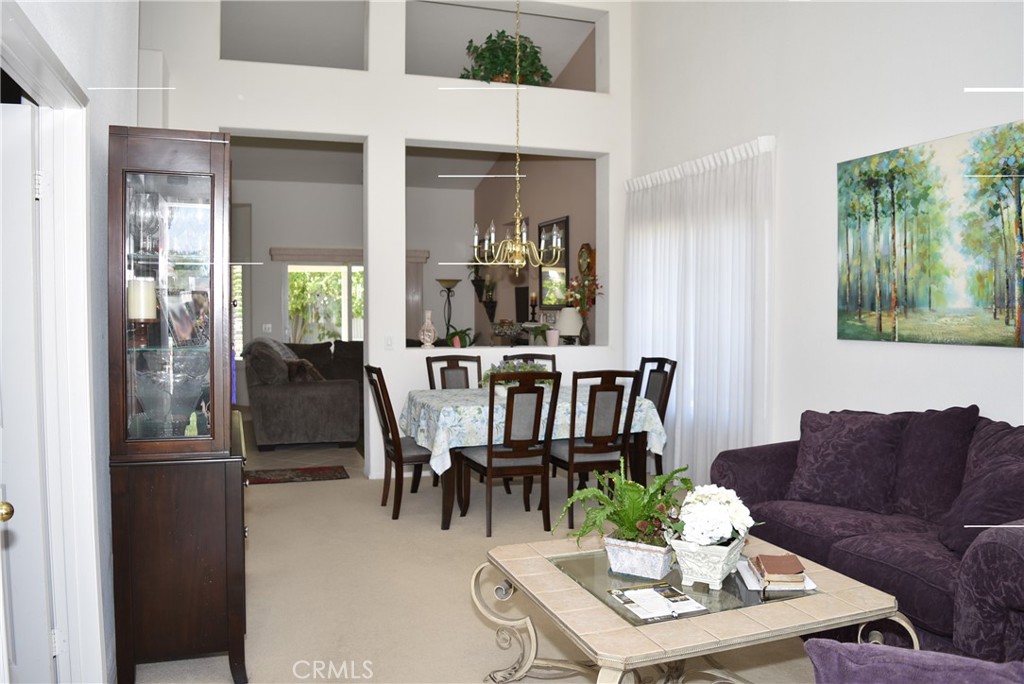 1665 Ravenswood Road Beaumont, CA 92223 - Photo 4 of 41 a view of a dining room with furniture window and outside view