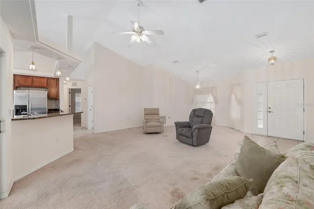 an empty room with windows and entrance