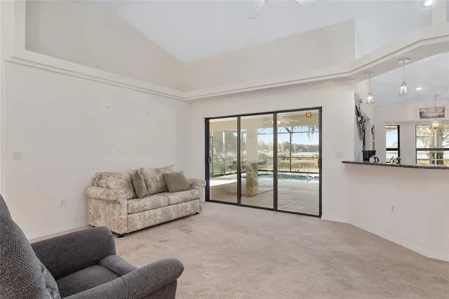 a kitchen with kitchen island granite countertop a sink a counter top space appliances and cabinets