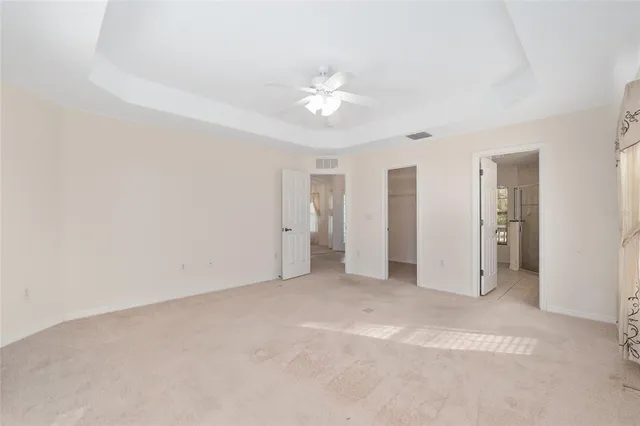 a bathroom with a granite countertop sink toilet a mirror and shower