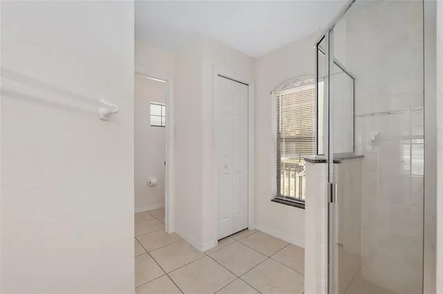 a view of an empty room with a window