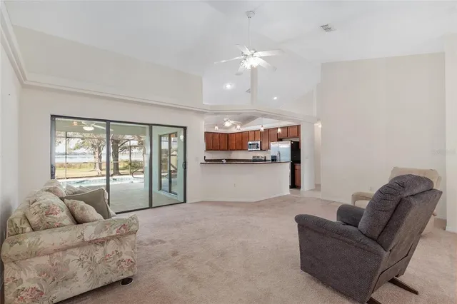 a kitchen with kitchen island a counter top space and stainless steel appliances