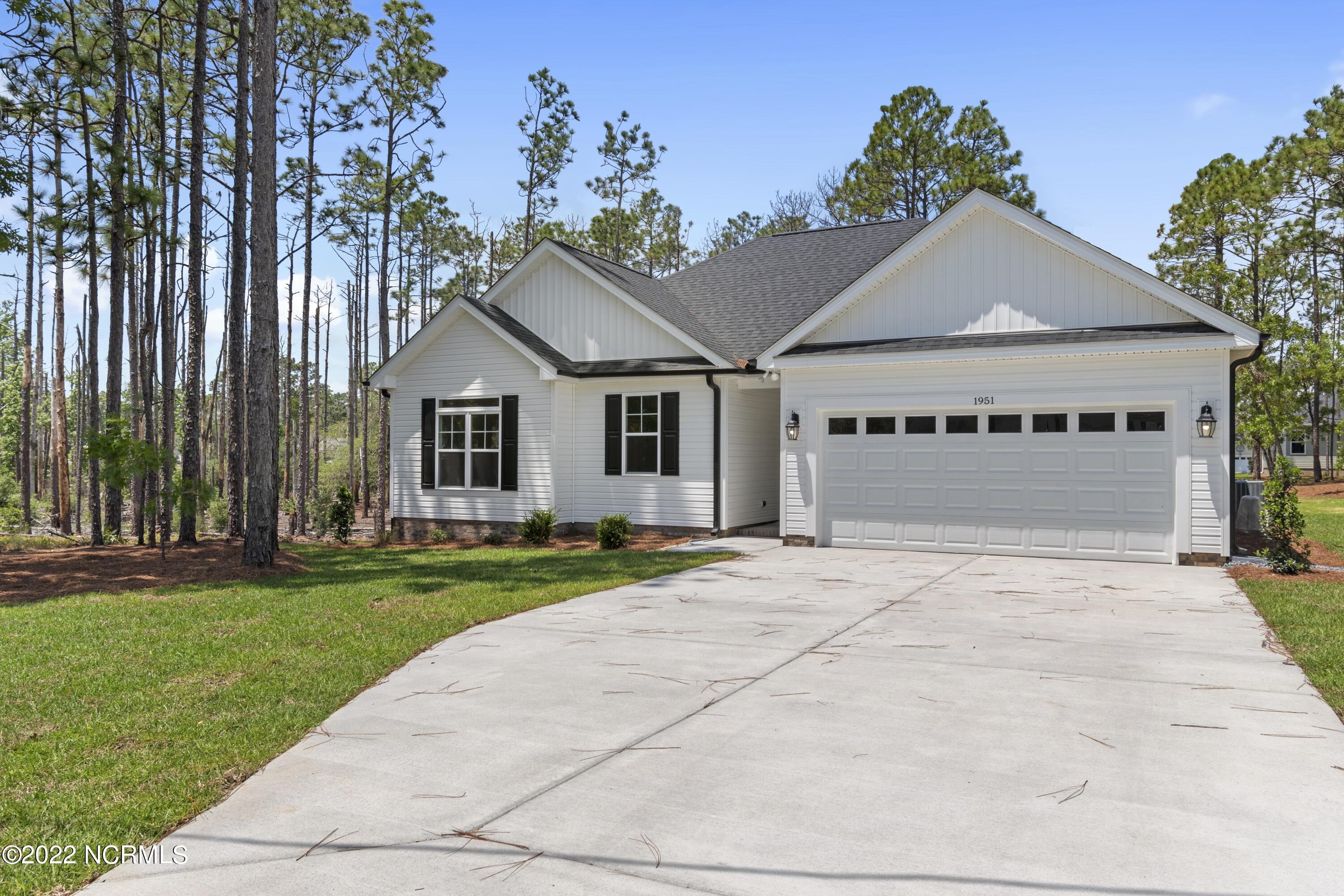 1115 East Boiling Spring Road Southport, NC 28461 - Photo 3 of 50 Previously Built Home Picture is a representation of what is to be built. Colors and finishes will vary and are subject to change.