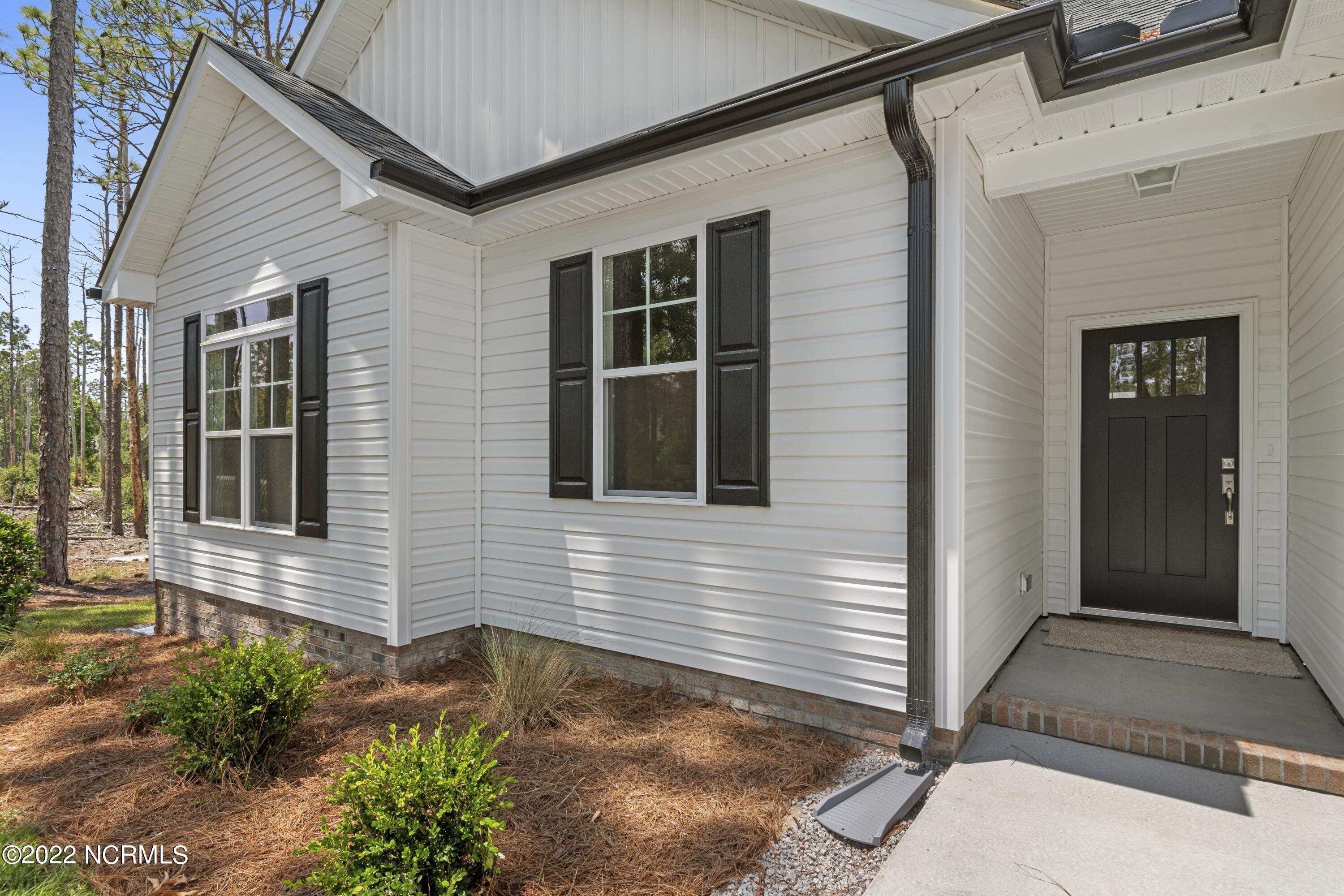 1115 East Boiling Spring Road Southport, NC 28461 - Photo 5 of 50 Previously Built Home Picture is a representation of what is to be built. Colors and finishes will vary and are subject to change.