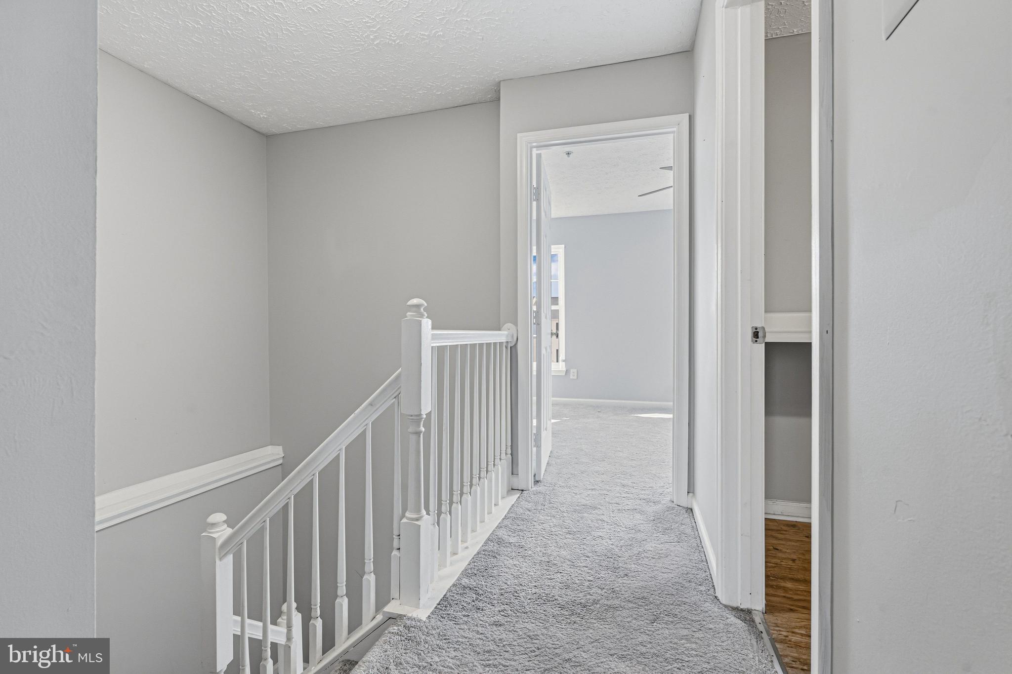 536 MacIntosh Circle Joppa, MD 21085 - Photo 14 of 32 a view of a hallway with wooden floor and entryway