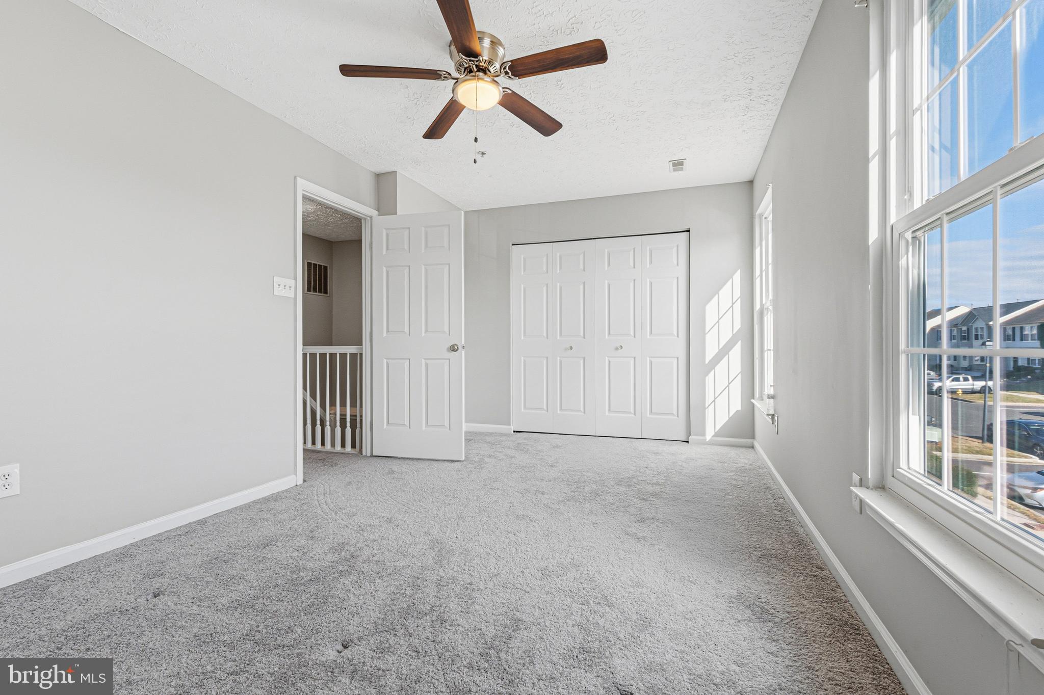 536 MacIntosh Circle Joppa, MD 21085 - Photo 16 of 32 an empty room with windows and fan