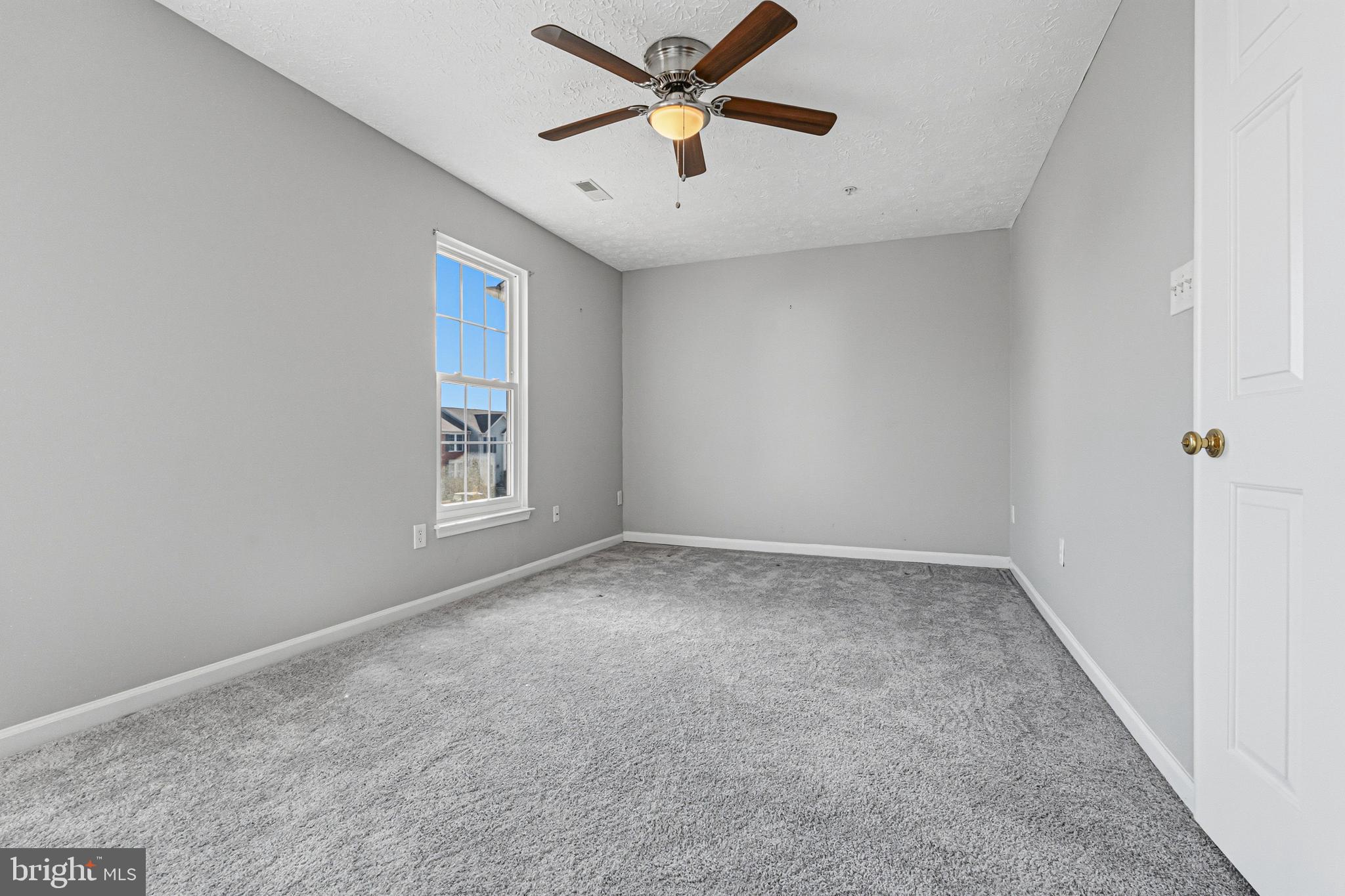 536 MacIntosh Circle Joppa, MD 21085 - Photo 17 of 32 an empty room with closet and windows