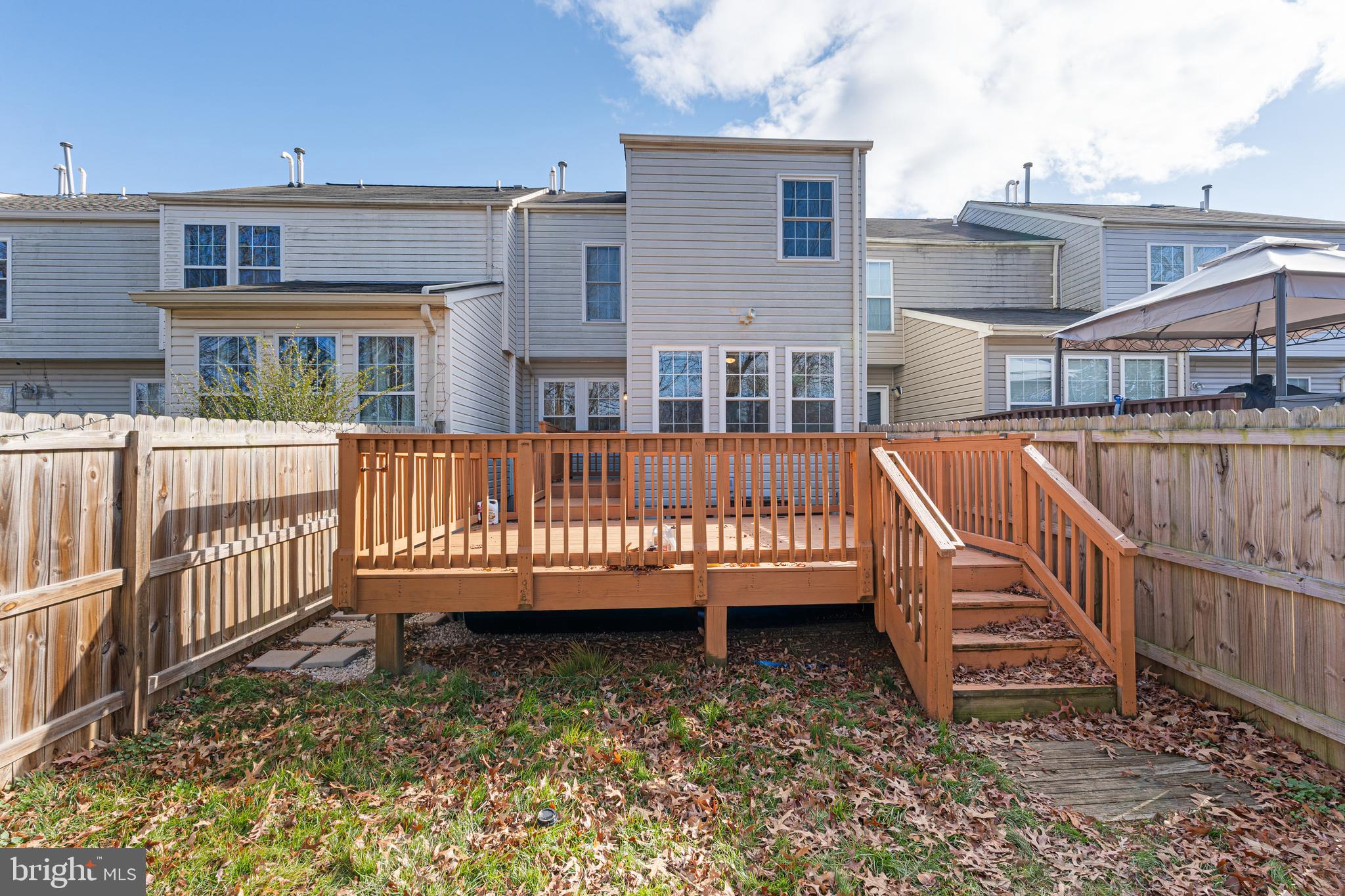 536 MacIntosh Circle Joppa, MD 21085 - Photo 25 of 32 a view of a house with wooden deck and furniture