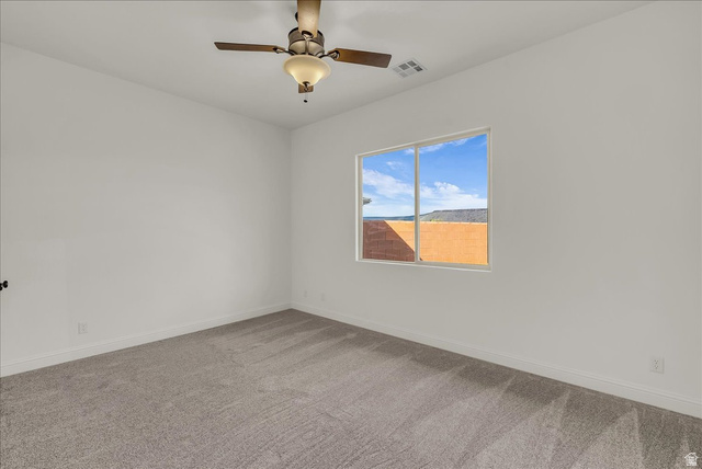 691 Rainier Drive St. George, UT 84770 - Photo 12 of 24 Unfurnished room with carpet flooring and a ceiling fan