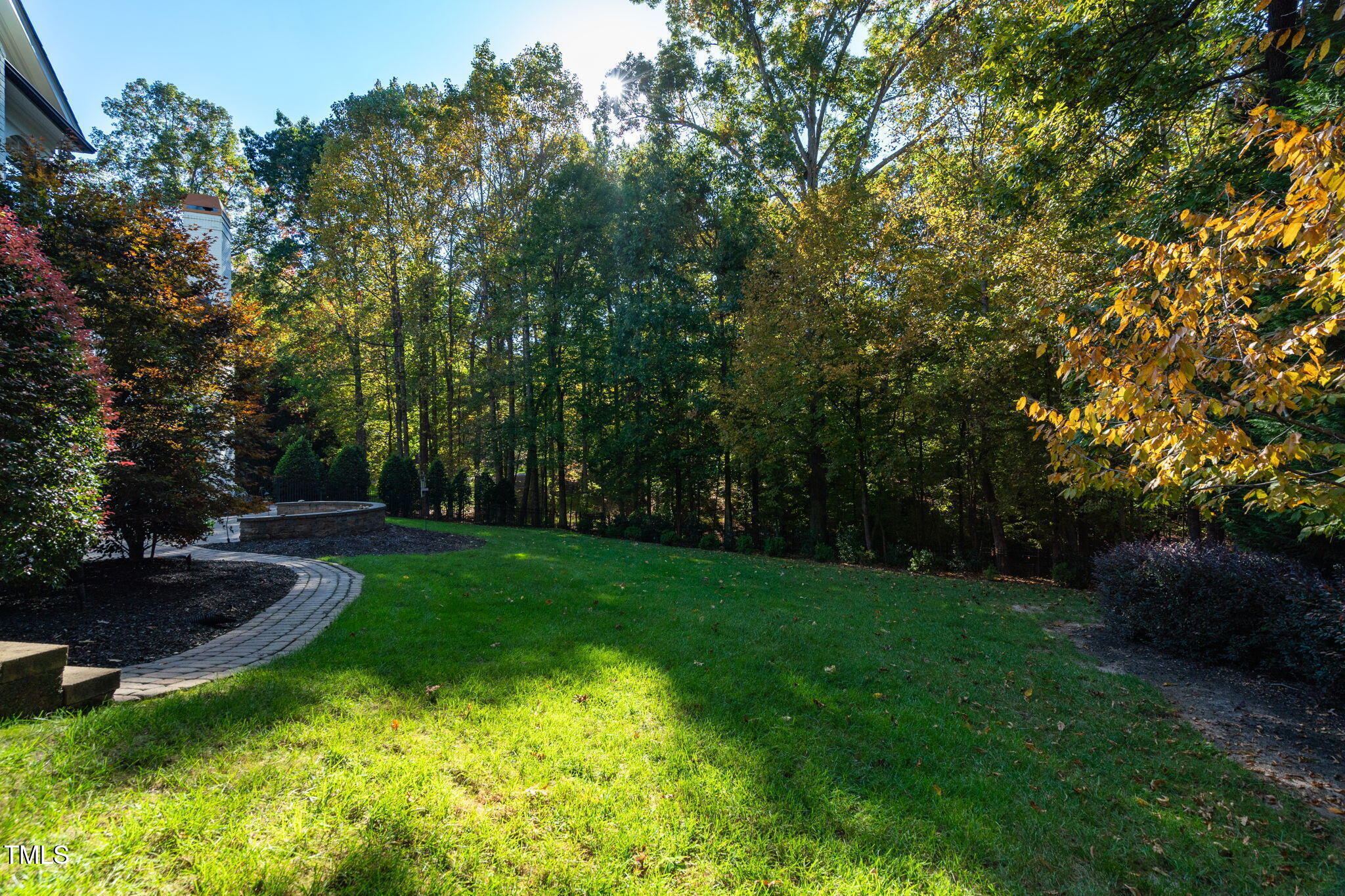 11201 Jonas Ridge Lane Raleigh, NC 27613 - Photo 69 of 79 Professionallly manicured grounds featuring landscape lighting, hardscaping, and irrigation.