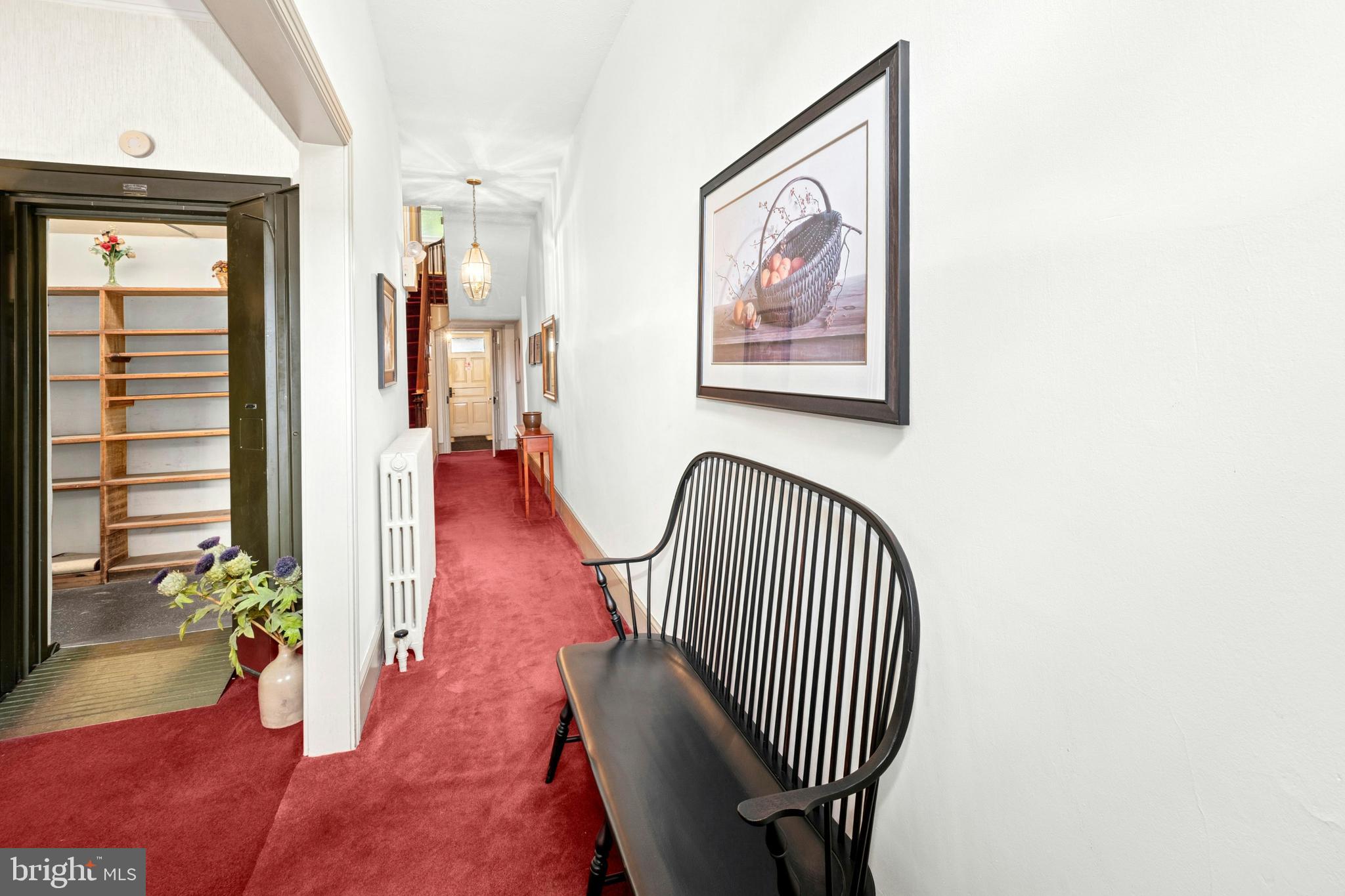 72-74 West Market Street Bethlehem, PA 18018 - Photo 11 of 36 a view of a hallway with wooden floor and a potted plant