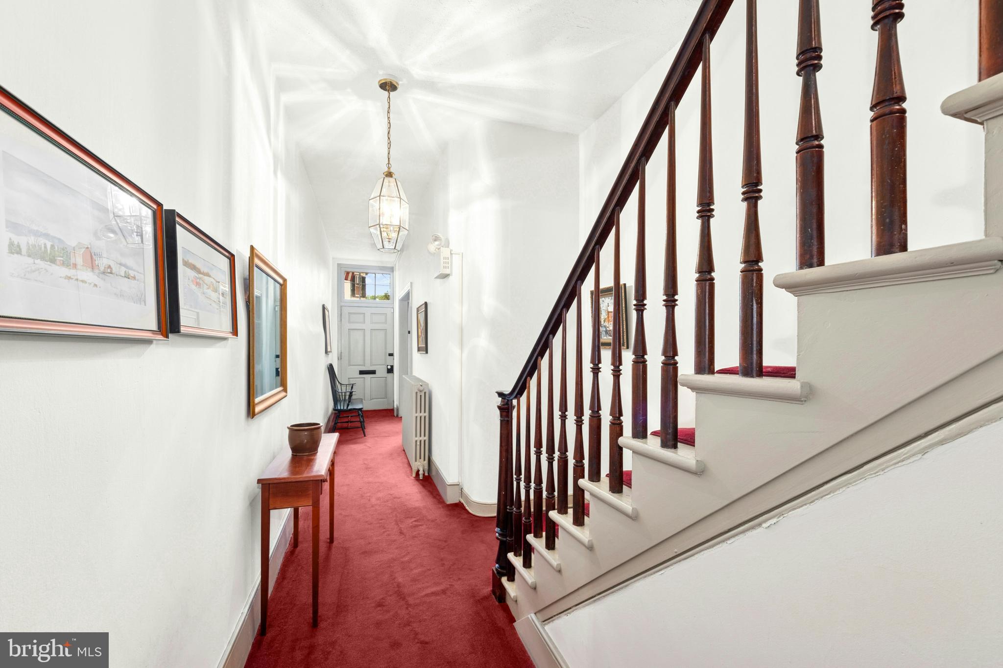 72-74 West Market Street Bethlehem, PA 18018 - Photo 13 of 36 a view of staircase with lots of frames on wall and a window
