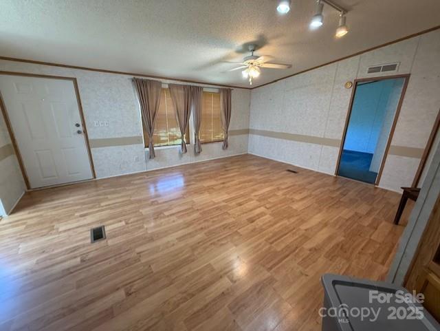 1017 Warlick Road Lawndale, NC 28090 - Photo 15 of 39 a view of an empty room with wooden floor and fan