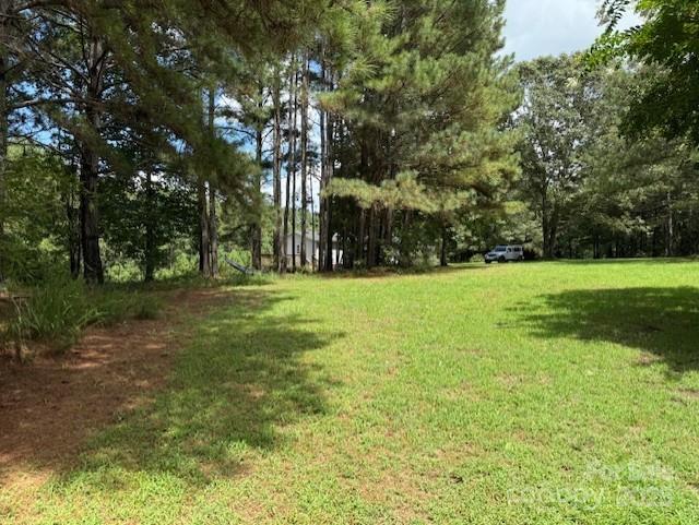1017 Warlick Road Lawndale, NC 28090 - Photo 32 of 39 a view of a field with trees in the background