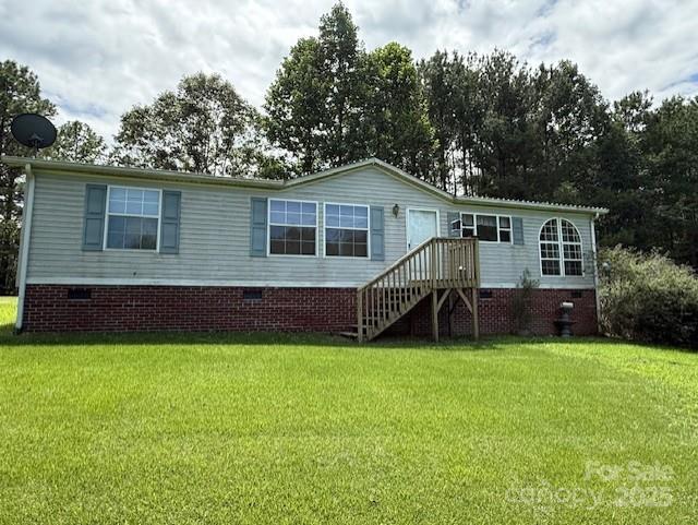1017 Warlick Road Lawndale, NC 28090 - Photo 38 of 39 a view of a house with a yard and sitting area
